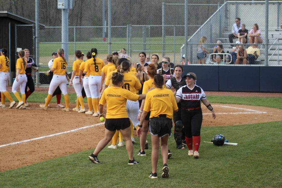 The womens softball team high-five the Indiana University-Purdue University Indianapolis team Tuesday in the game against Indiana University-Purdue University Indianapolis at the USI Softball Field.