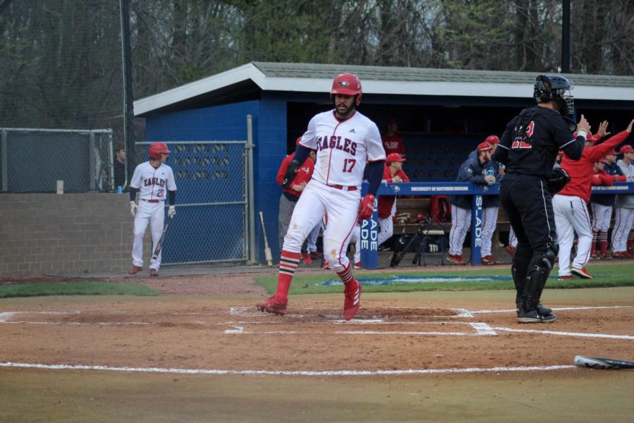 Daniel Lopez, junior infielder, runs across home plate from third base Thursday in the game against Southeast Missouri State University at the USI Baseball Field.