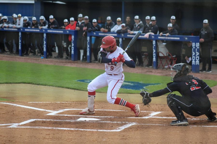 Ricardo Van Grieken, sophomore infielder, swings at a ball Thursday in the game against Southeast Missouri State University at the USI Baseball Field.