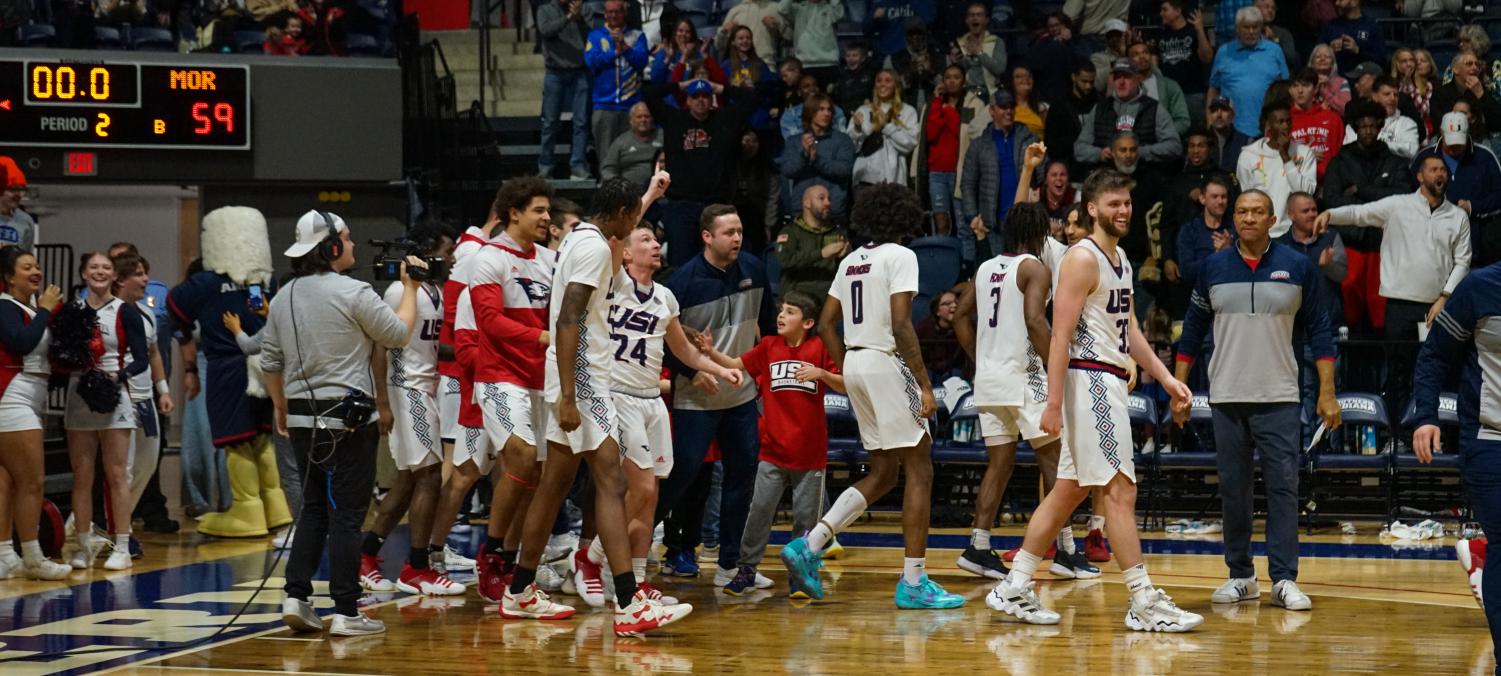 Jack Campion, freshman guard, points to the sky after hitting a buzzer-beater to tie the game against Morehead State at the men’s basketball game Feb. 4 in the Screaming Eagles Arena.