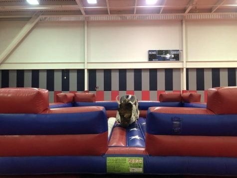 A mechanical bull is set up at Condom Carnival Wednesday for attendees. (Photo by Alyssa DeWig)