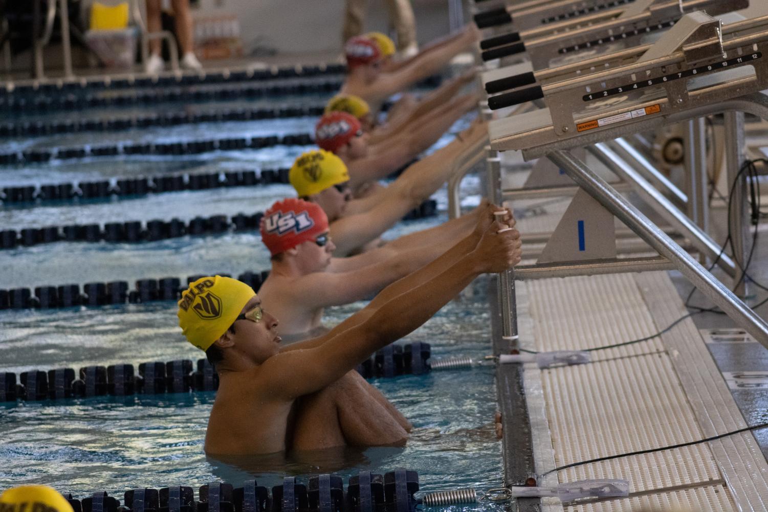 The men’s swim team prepares to compete against Valparaiso’s team in the Aquatic Center Oct. 1, 2022.