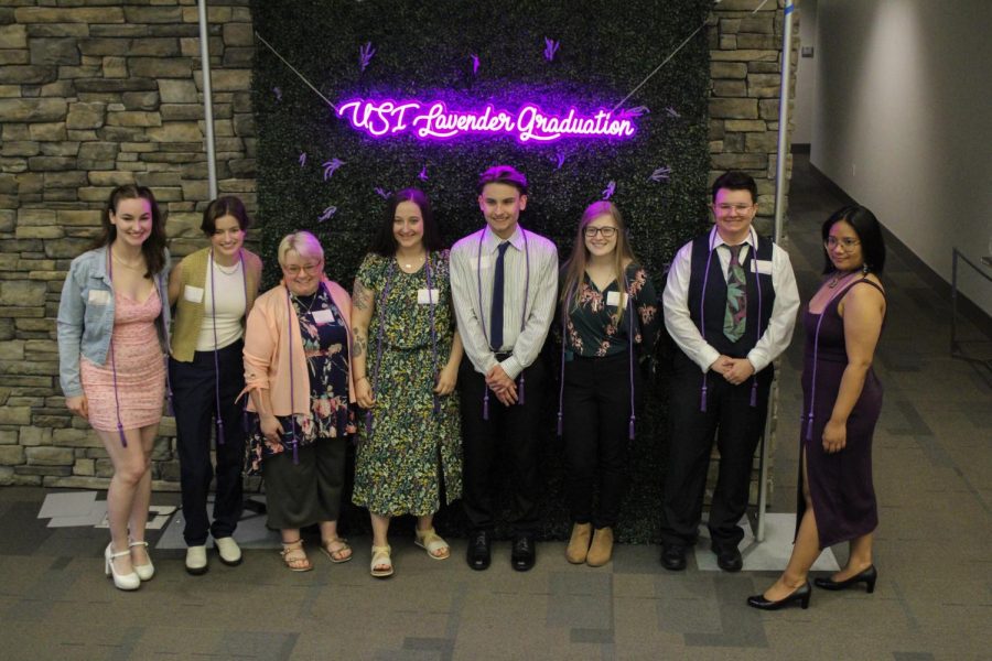 Graduates pose for a photo after the 2023 Lavender Graduation ceremony Thursday in the Griffin Center.