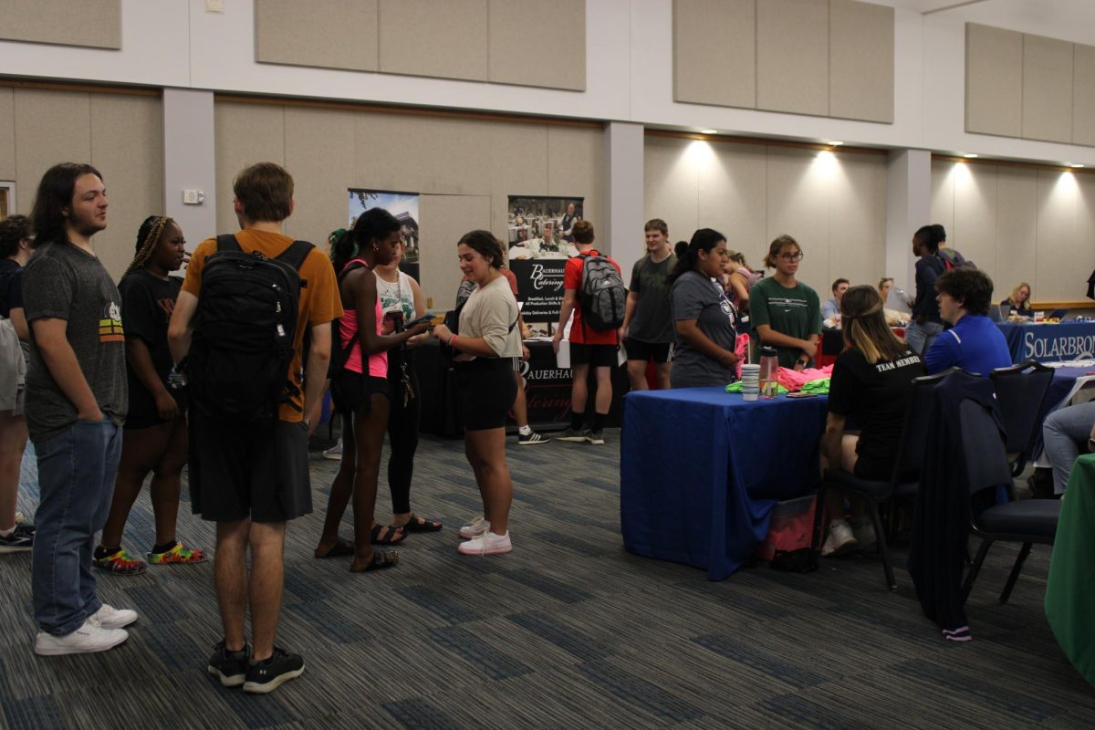 Attendees+visit+tables+Wednesday+at+the+Part-Time+Job+Fair+in+Carter+Hall.+Organizations+came+to+the+event+to+promote+part-time+job+opportunities+available+for+students.