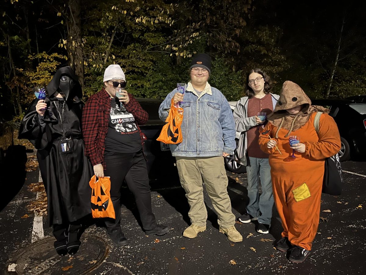 Students pose in a parking lot on their way to the Boo Bash Monday hosted by Housing and Residence Life. The Boo Bash was a trick-or-treating event in the multipurpose rooms of Newman Hall, Governors Hall, OBannon Hall and Ruston Hall.