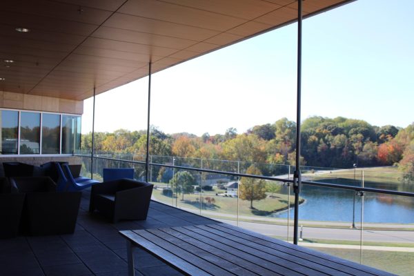 The second-floor balcony in the Business and Engineering Center is a great spot to study outside. The balcony has a beautiful view of trees and Reflection Lake.