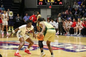 Jordan Tillmon, junior guard, guards a Tiffin University player Tuesday in the Screaming Eagles Arena. (Photo by Peyton Peters)