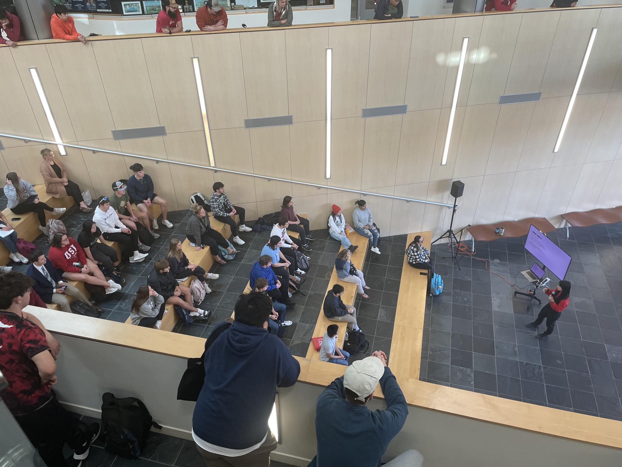 Students gather to watch a presentation by Kyla Scanlon, content creator and founder of financial education company Bread, Wednesday in the ODaniel Atrium located in the Business and Engineering Center. 