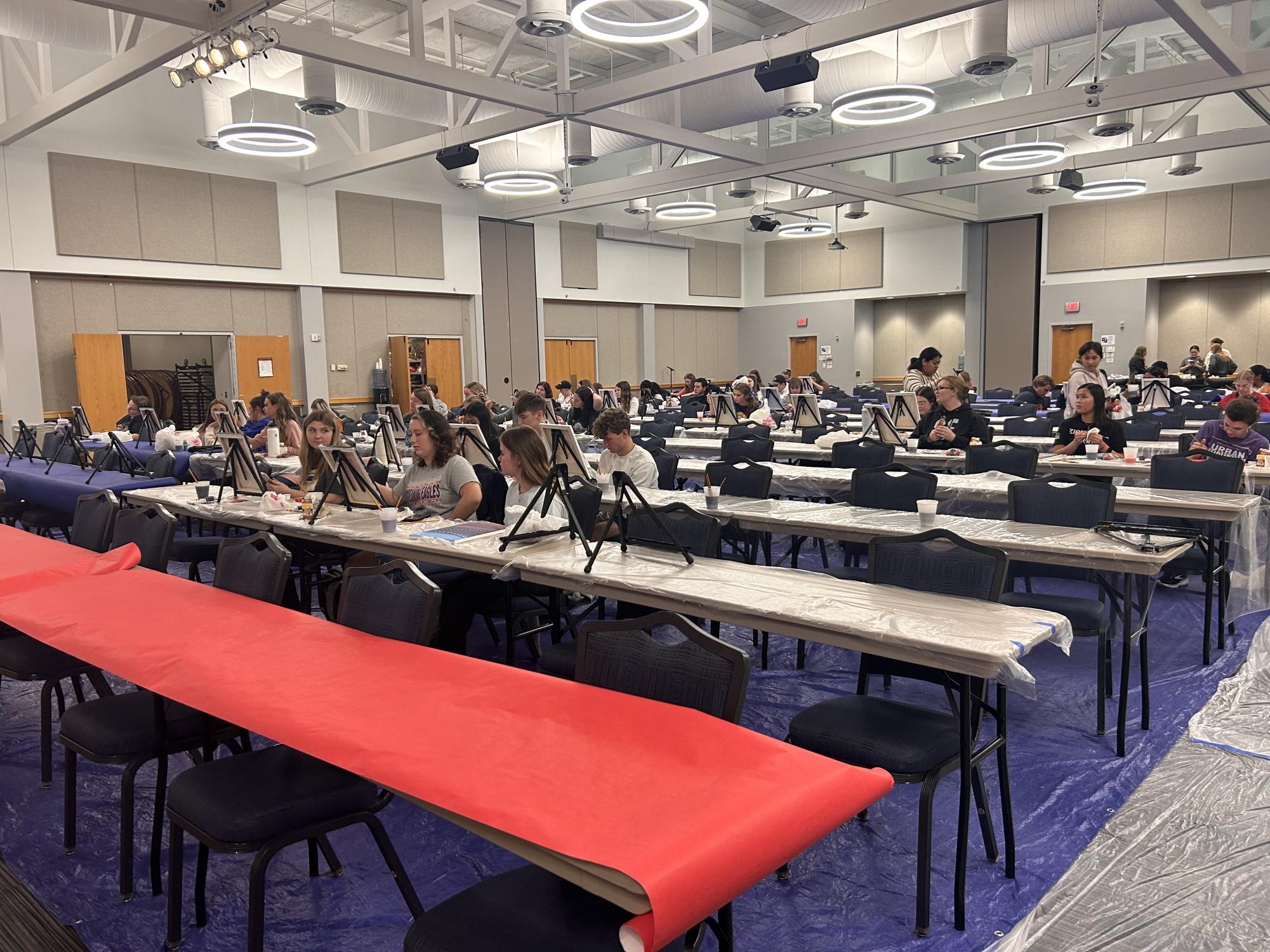 Students prepare to paint at the Cookies and Canvas event hosted by the Activities Programming Board Monday in Carter Hall.