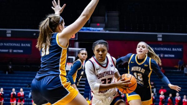 Triniti Ralston, freshman guard, drives to the basket as three Murray State defenders attempt to stop her Friday in the Screaming Eagles Arena. (Photo courtesy of Elizabeth Randolph and USI Athletics)