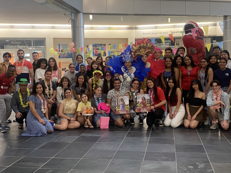 Students gather around University Center West and University Center East Queens during the Panamanian Carnival April 19, 2023, in the Business and Engineering Center. (Photo by Aracely Chavez)