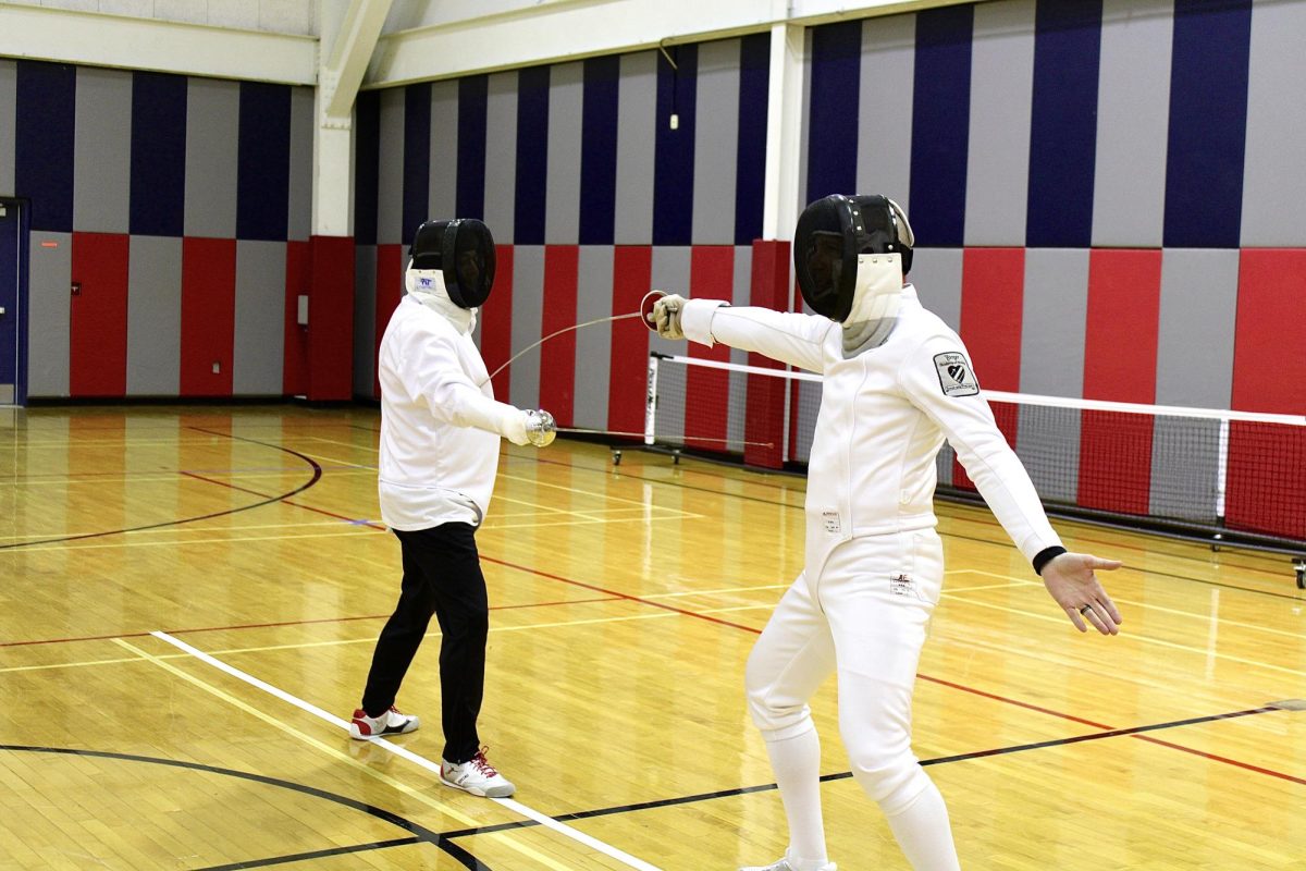 The Fencing Club has one coach , Tom Fuller, a certified fencing coach, and one advisor, Jason Hardgrave, associate professor of history and interim assistant provost for Academic Affairs. Here they demonstrate a dueling drill to the Fencing Club participants Thursday at the Recreation, Fitness and Wellness Center. 