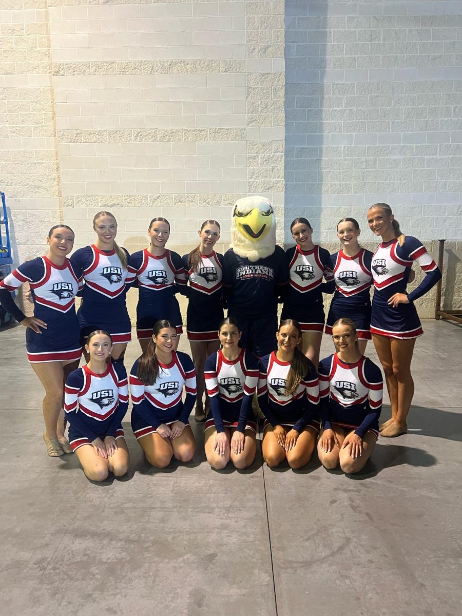 Members+of+USI+dance+team+smile+with+Archie+the+Eagle+after+competing+in+the+spirit+rally+performance+Thursday+afternoon+at+Daytona%2C+Florida.