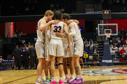 The 2023-2024 men's basketball team huddles during the game against Western Illinois University Thursday in the Screaming Eagles Arena. (Photo by Peyton Peters)
