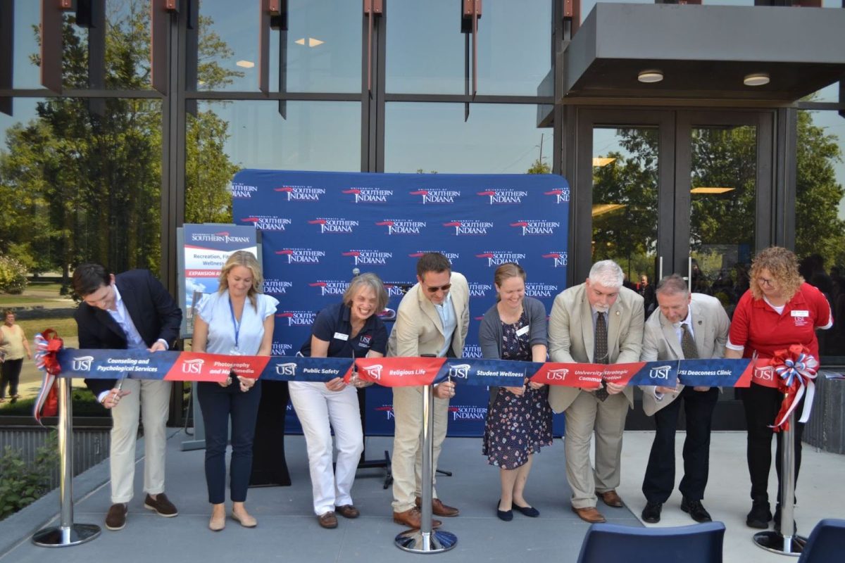 USI faculty and staff cut a ribbon in front of the Recreation, Fitness and Wellness Center Tuesday to inaugurate the renovation of the building.