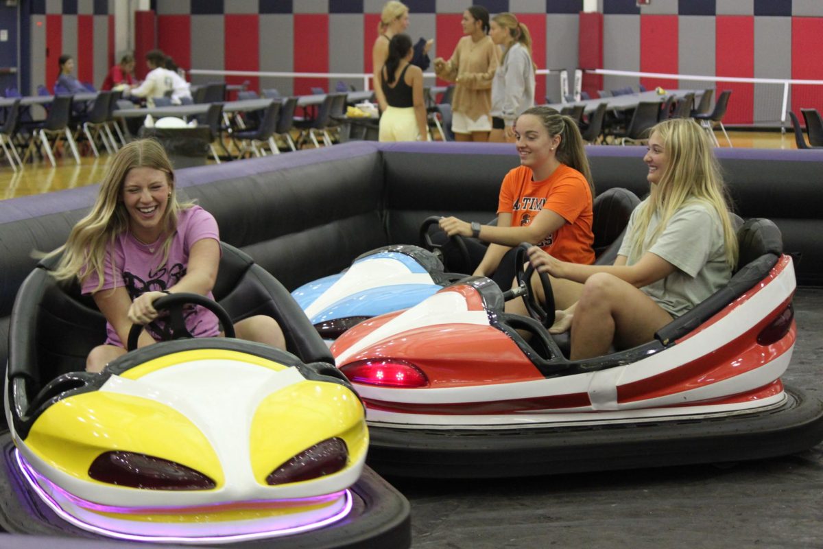 Audrey Strickland, sophomore health administration major, Kayla Willoughby, senior exercise science major, and Lucy Schwomeyer, sophomore elementary education major, drive bumper cars Wednesday in the RFWC. 