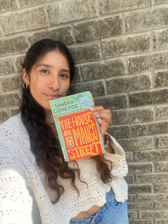 Aracely Chavez, news editor, holds “The House on Mango Street.” Chavez enjoys this book for its relatability and message of finding oneself and belonging. 