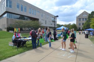 Students visit the Art Club table at the Student Involvement Fair Wednesday on The Quad. 