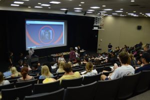 Students watch campaign advertisements from past elections Tuesday in the Brycon C. Wright Administration Building Forum 1.