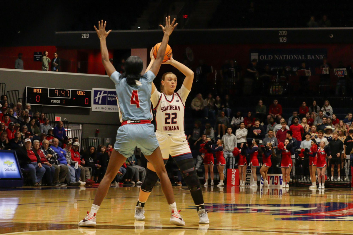 Meredith Raley, senior forward, looks to find an open teammate during the first-round matchup against the University of Illinois at Chicago in the Women's National Invitational March 25 in the Screaming Eagles Arena.