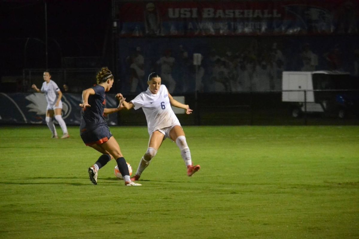 Adriana Berruti, senior midfielder, clashes with a UT Martin player for possession of the ball Thursday at Strassweg Field. (Photo by Alex Mendoza)