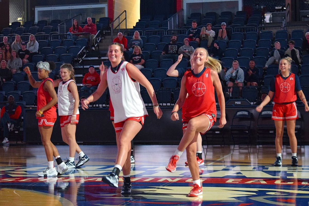 The women’s basketball team dances to “I'm Shipping Up to Boston” by the Dropkick Murphys Thursday in the Screaming Eagles Arena. (Photo by Alex Mendoza)
