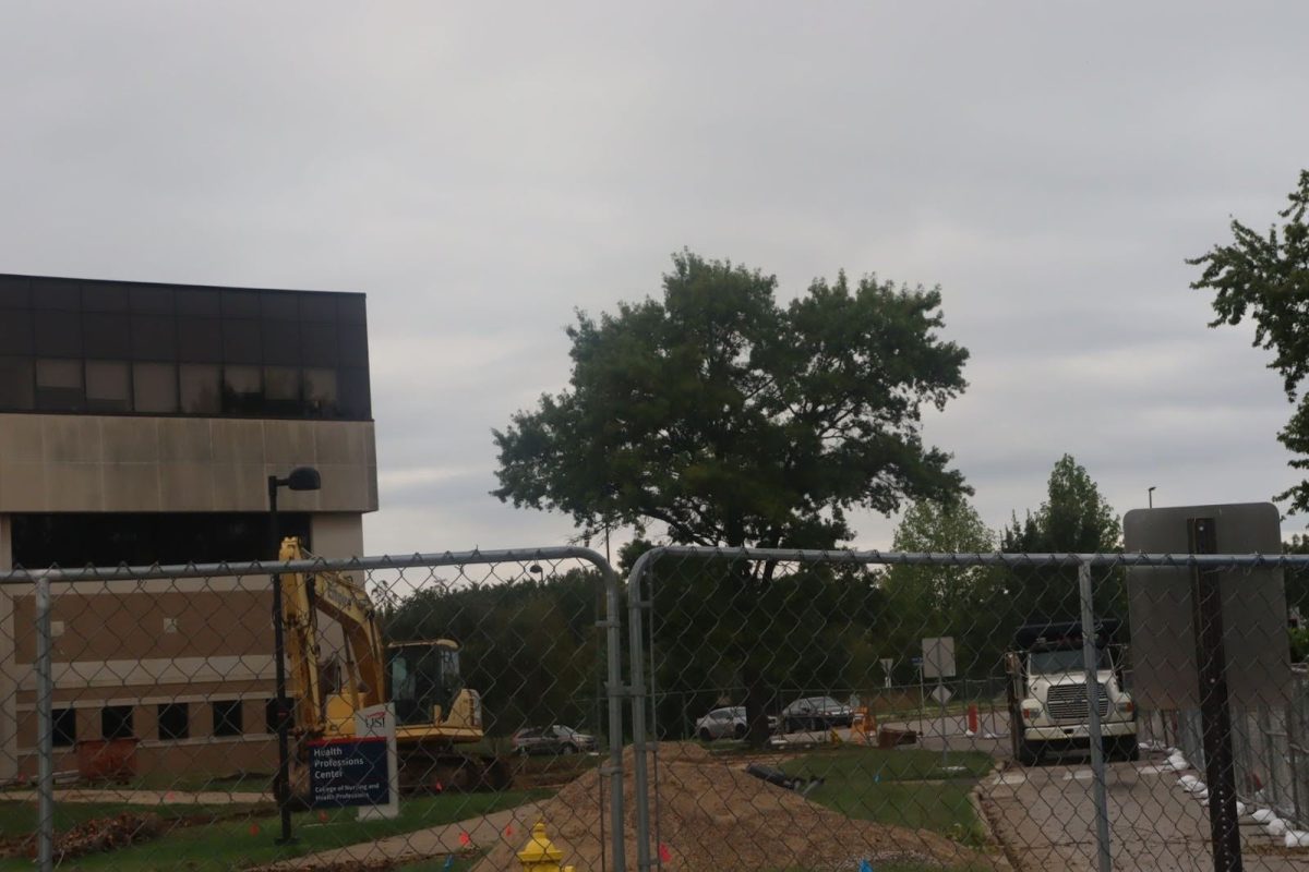 A fence blocks the entrance to the Health Professions Center and the southbound lane of the University Blvd road Sept. 30. Phase four of construction in the Health Professions Center began Sept. 23. The fence is expected to remain in place until the end of 2025.