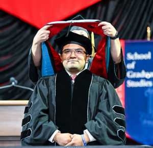 César Berríos, assistant dean of students and athletic diversity and inclusion designee graduated from USI in May 2023 with a doctorate in education.