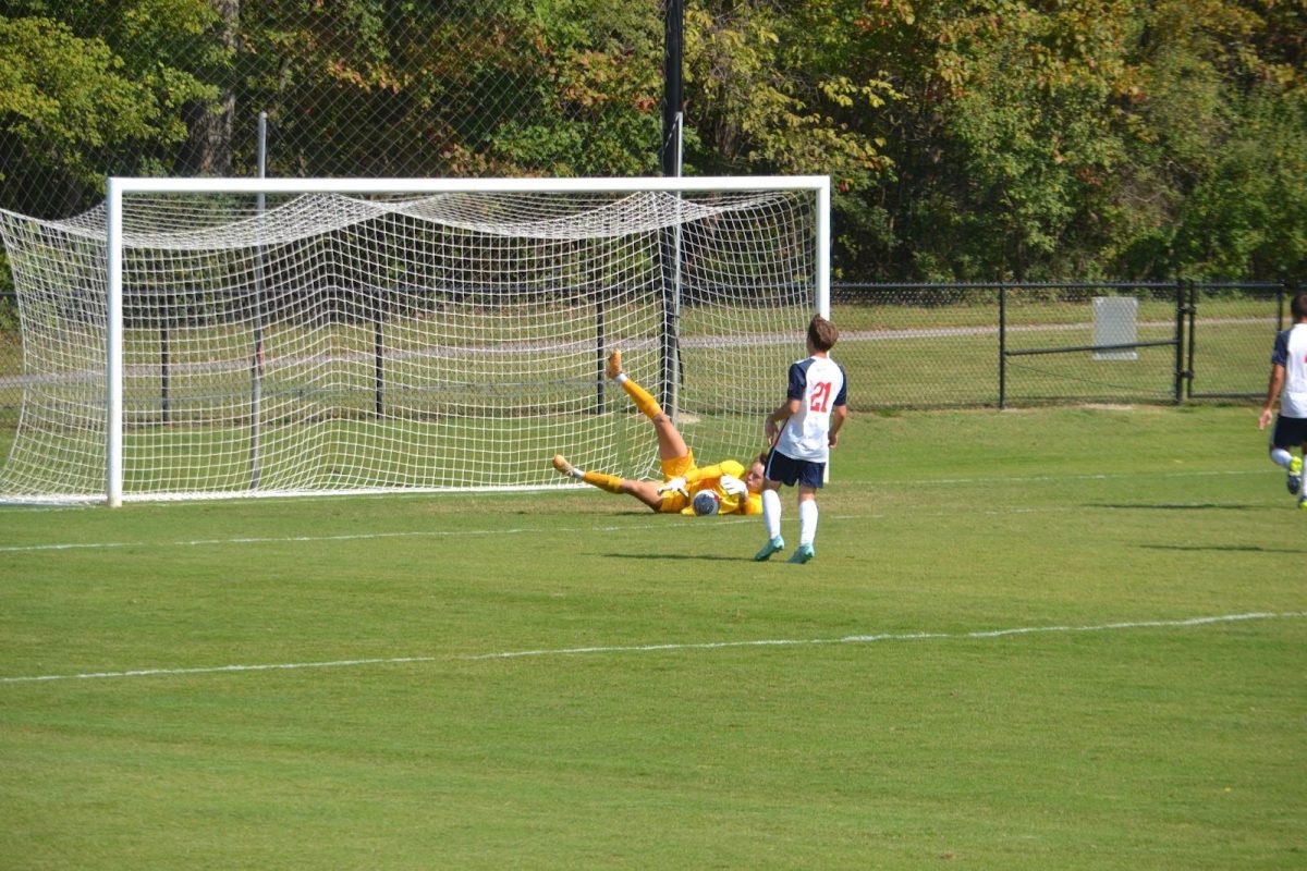 Andrew Klott, sophomore goalkeeper, saves a potential goal from a UIW player Sunday at Strassweg Field. (Photo by Alex Mendoza)
