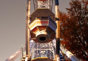 A Ferris wheel spins Oct. 8 at the West Side Nut Club Fall Festival. The festival is hosted every year with carnival attractions and booths.