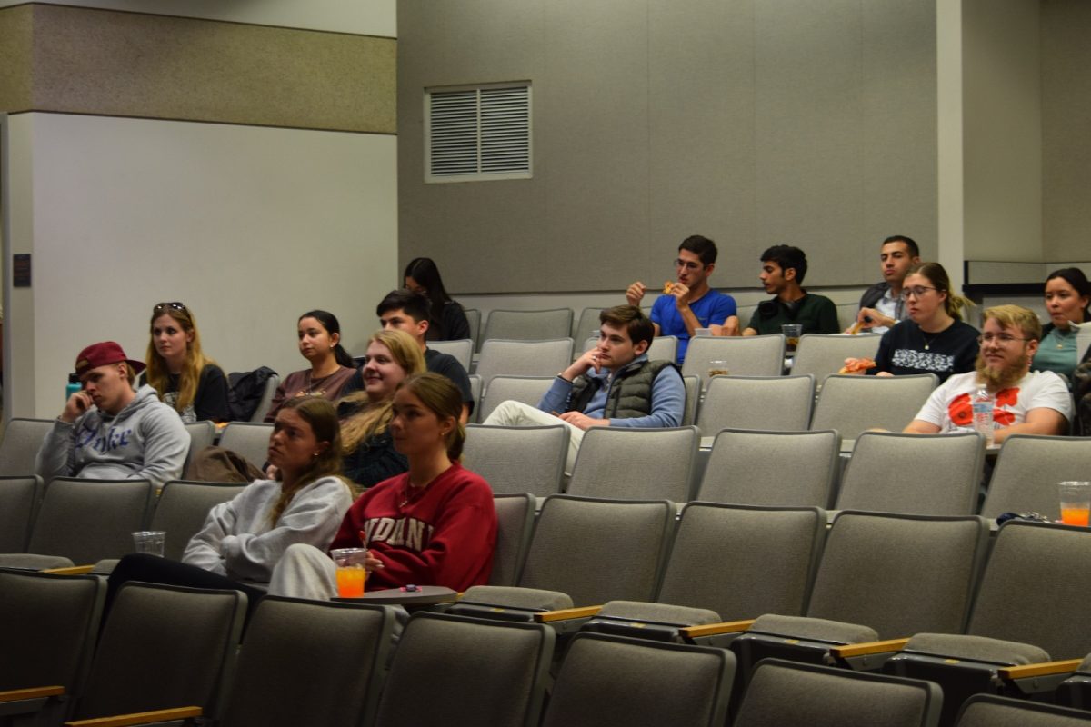 Students sit and eat refreshments before the final Indiana Gubernatorial Debate begins Thursday in Kleymeyer Hall.