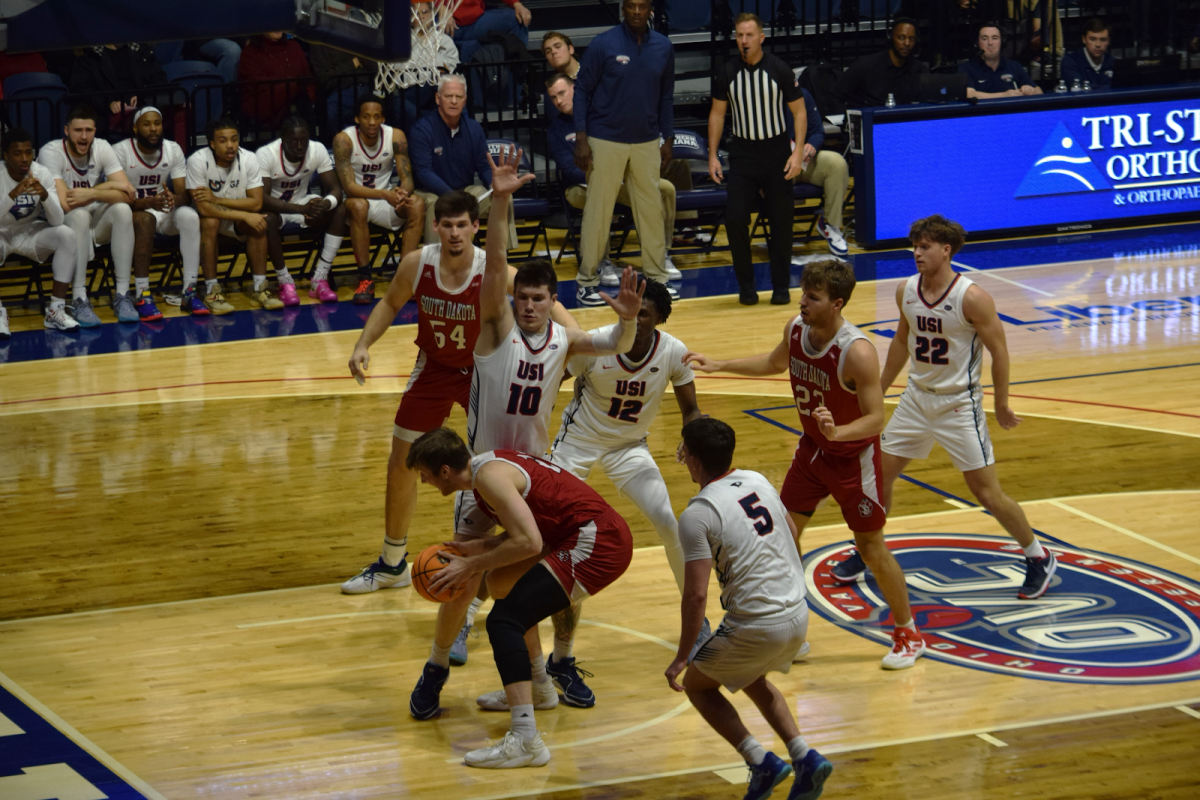 Jack Mielke, graduate forward, puts his hands up defending an opposing forward down low in the post Friday in Liberty Arena. (Photo by Will Kessinger) 
