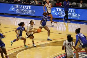 Triniti Ralston, sophomore guard, dribbles the ball into the paint while Saint Louis University defenders attempt to get back on defense Sunday in Liberty Arena. (Photo by Alex Mendoza)
