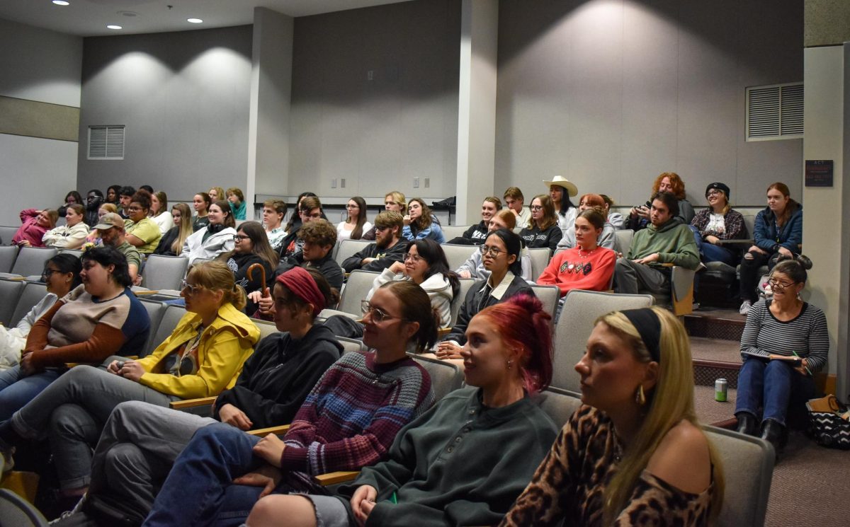 Attendees listen to the juror’s talk Wednesday in Kleymeyer Hall. 