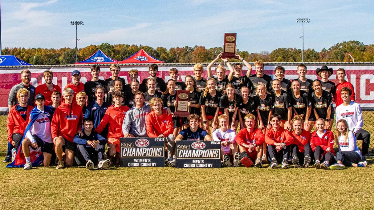 The men's and women's cross country teams celebrate winning the 2024 Ohio Valley Conference championship, the first for USI, Nov. 1 at Skyhawk Runaway Trail in Martin, Tennessee. (Photo courtesy of The Ohio Valley Conference and USI Athletic Communications) 
