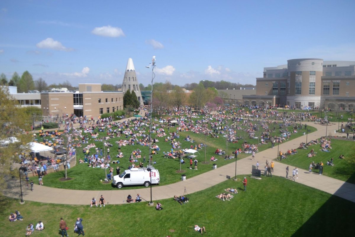 About 7,000 visitors and students gather to watch the solar eclipse on The Quad April 8. 