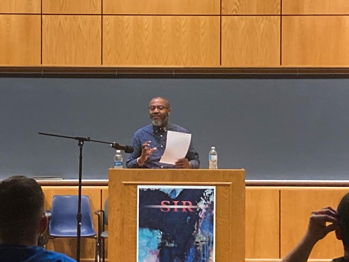 Mitchell L. H. Douglas, assistant professor of English at IU Indianapolis, reads one of his poems at the poetry reading Thursday in Kleymeyer Hall.