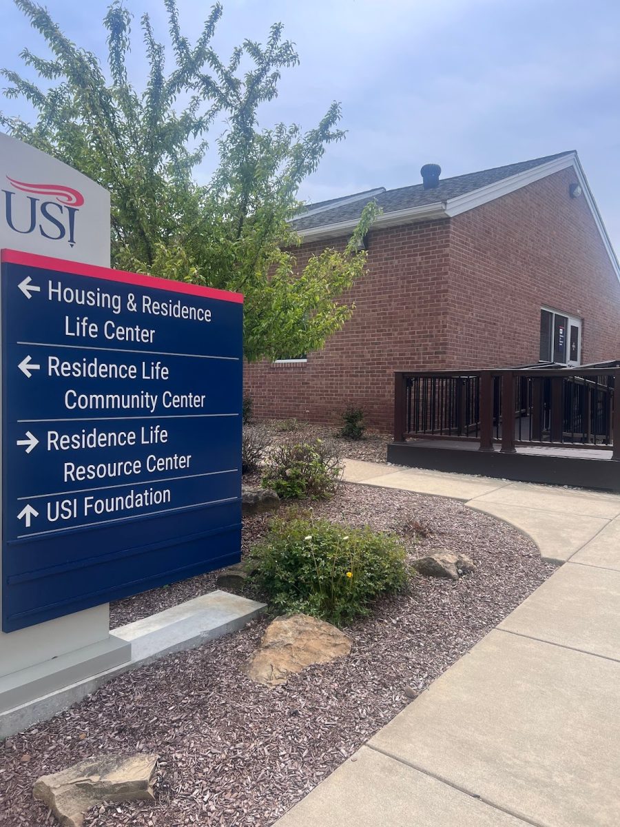 A directional sign on the corner of Clarke Lane and O’Daniel Lane points the direction to many different HRL facilities on campus, Saturday, April 19. The Residence Life Center, located in the background, will serve as the new package center for the upcoming school year. (Photo by Cade Smithson)