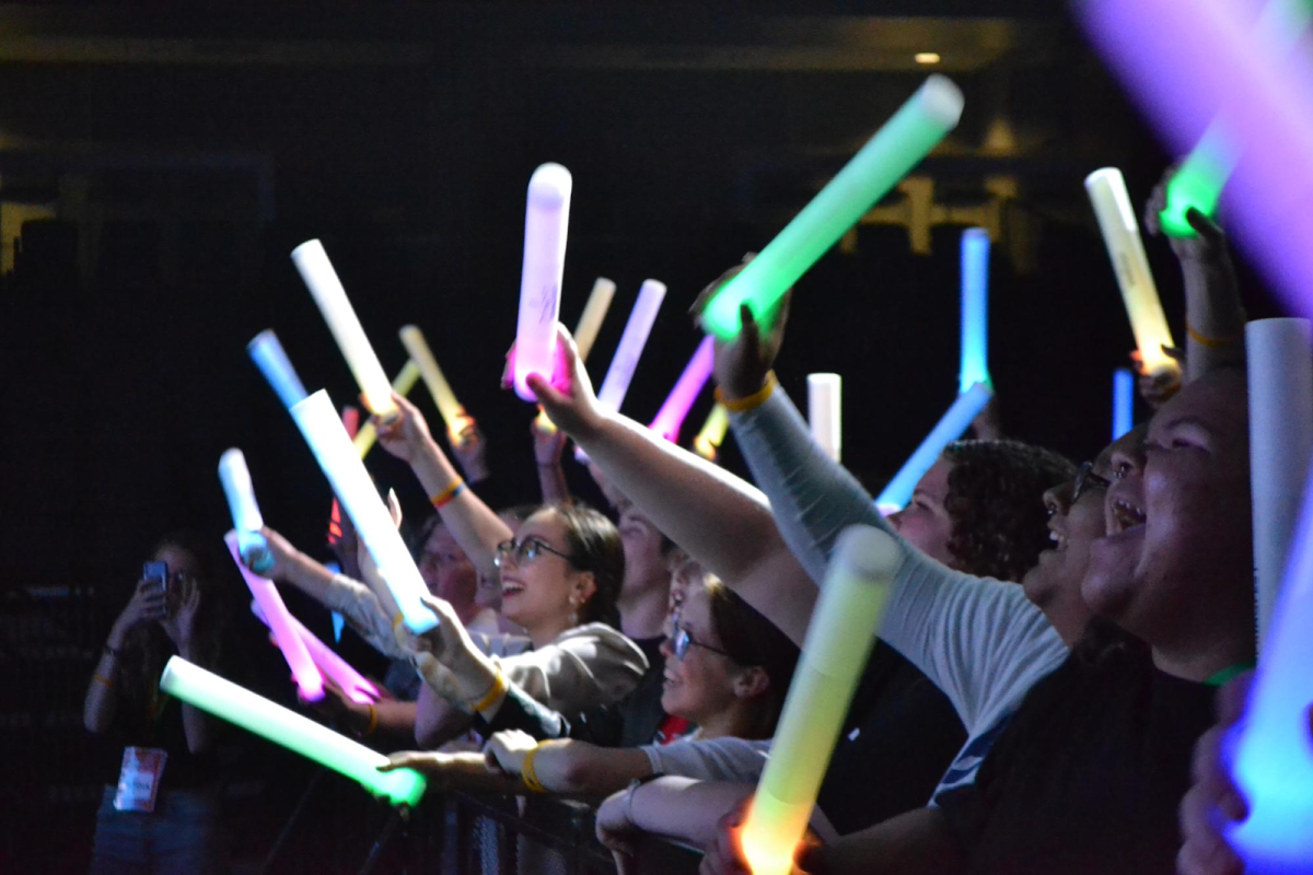  Audience members cheer at the SpringFest concert 2024 in Liberty Arena.