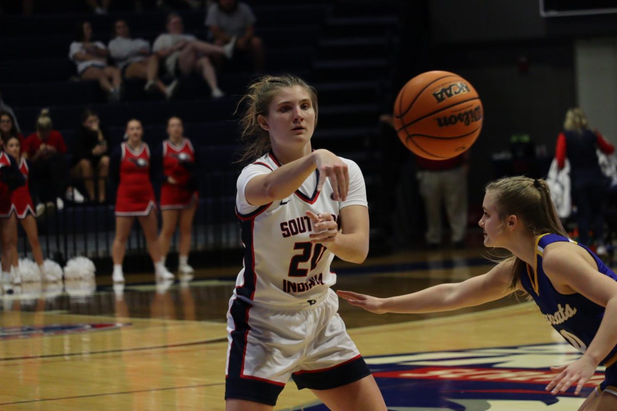 Vanessa Shafford, senior guard, passes the ball to a teammate as she is closely guarded by a Brescia University guard Nov. 4 at Liberty Arena. (Photo by Will Kessinger)