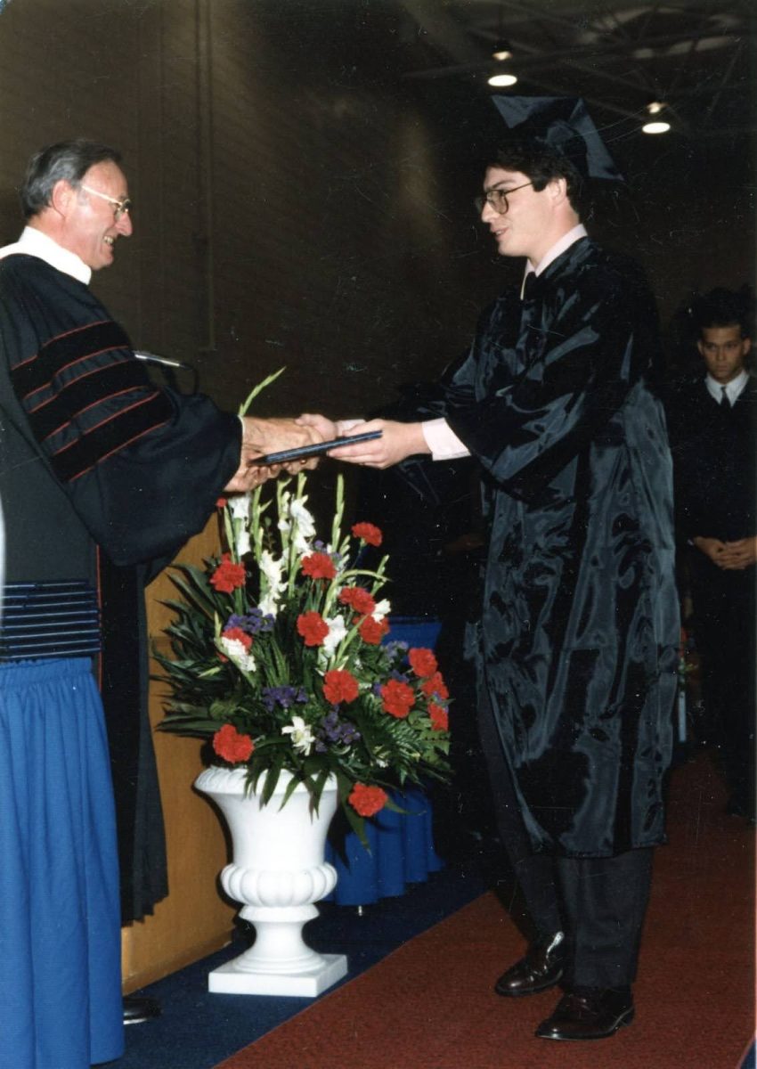 Steven Bridges receives his degree from David L. Rice during his graduation in 1991. Bridges keeps this picture on his desk in his office. (Photo courtesy of Kaylee Johnson)