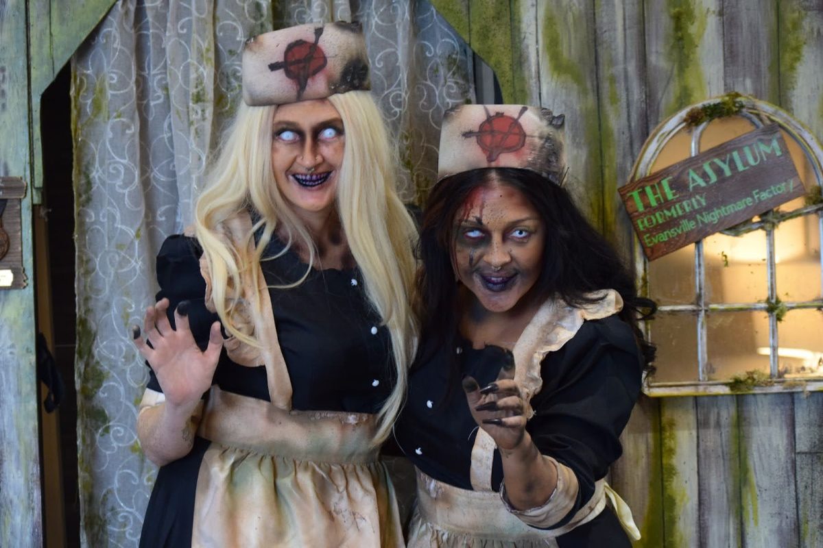 Scare actors from The Asylum, a haunted house, pose at Raptor Con Sunday in the Old National Events Plaza. 
