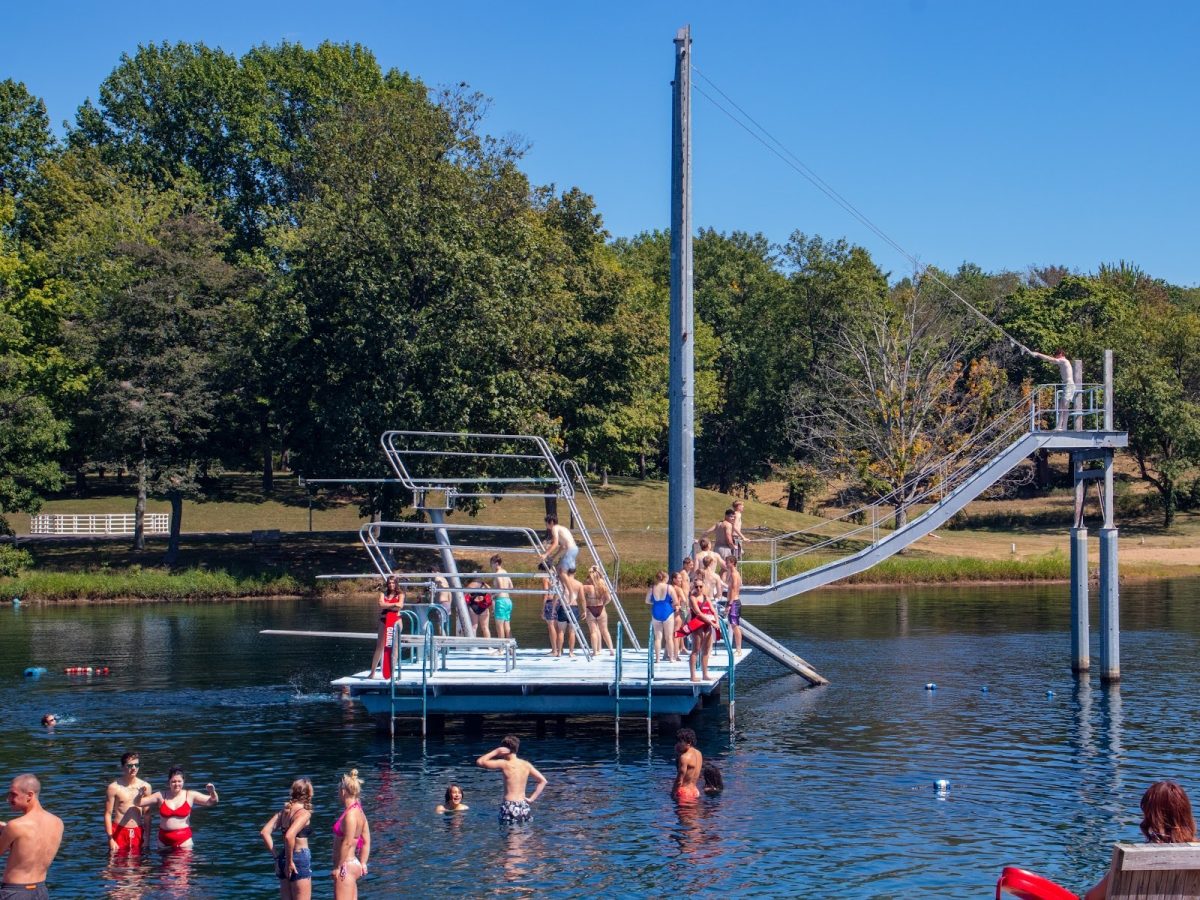 Students line up to use the diving boards and water swing Monday, Sept. 1, at New Beginnings Lakeside Church
