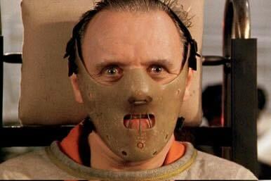 Hannibal Lecter (Anthony Hopkins) stares grimacingly while restrained by a straitjacket in "The Silence of the Lambs” (1991).