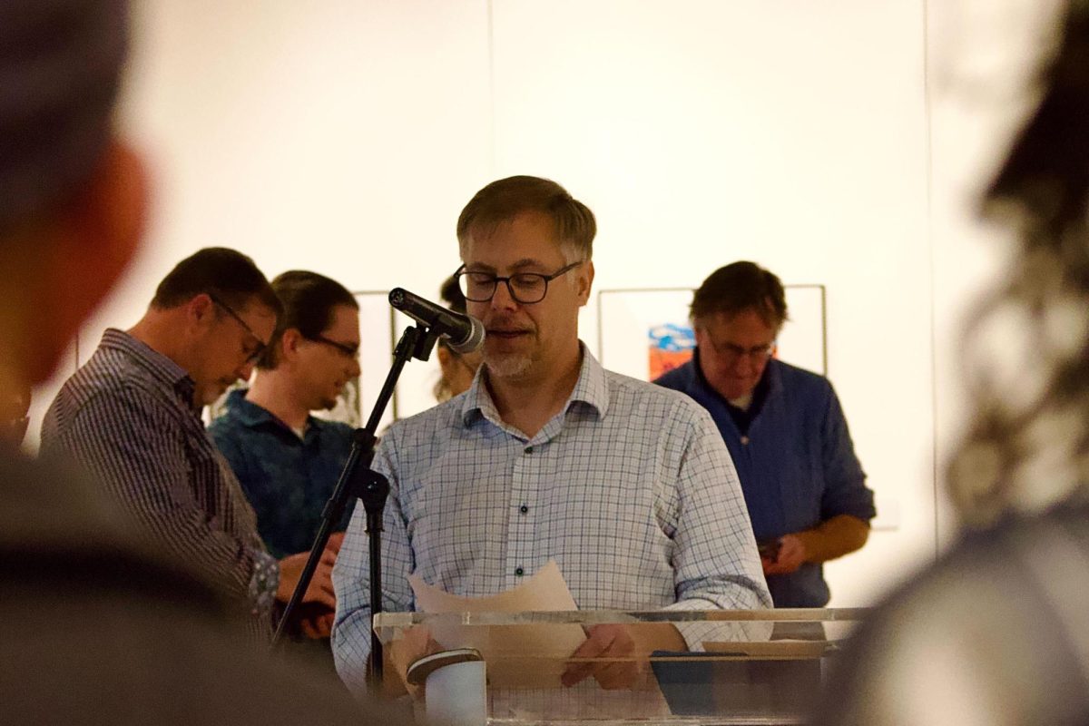 Brett Anderson, associate professor of art and director of the McCutchan Art Center and Pace Galleries, awards participants and expresses gratitude for their hard work during the Efroymson Family Fund Juried Student Art Show Sunday, Nov. 16. 
