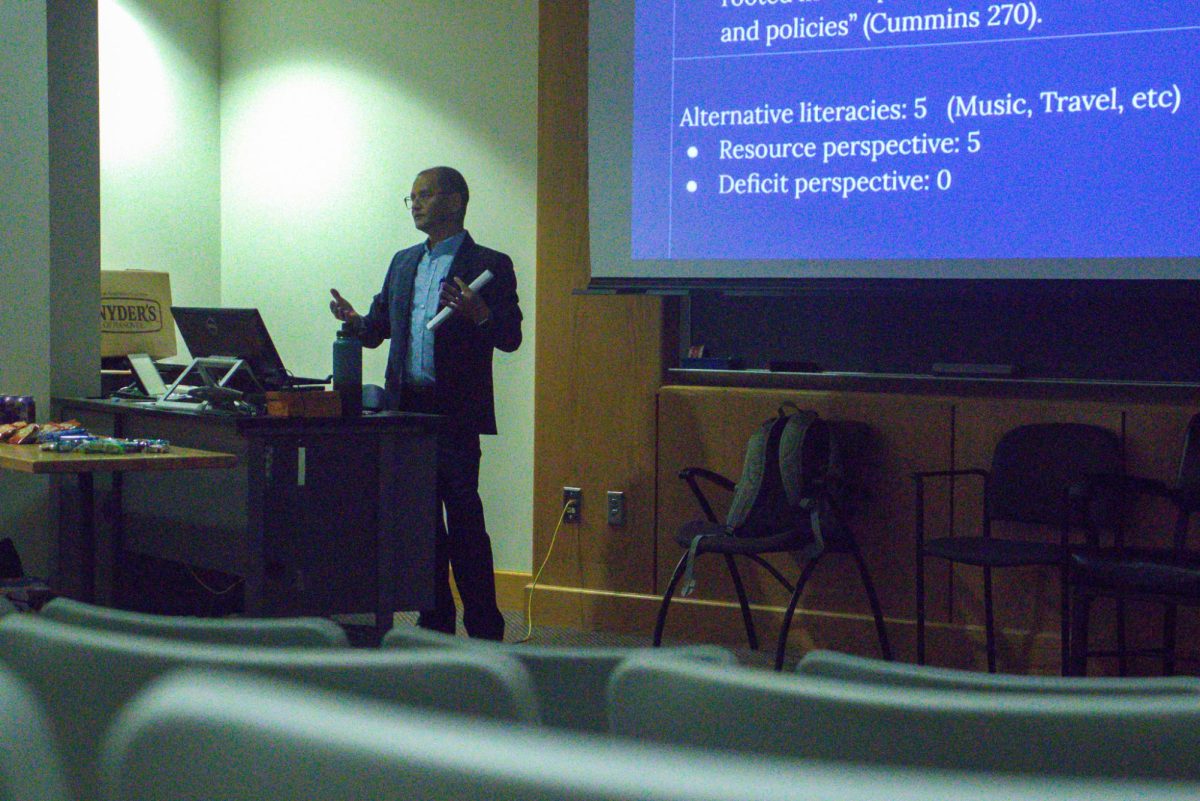 Thir Budhathoki, assistant professor of English, begins his lecture on rhetorical literacies during his colloquium “Literacies and Reflective Rhetorical Moves in the Literacy Narrative Assignment”  in Kleymeyer Hall Thursday, Nov. 13.