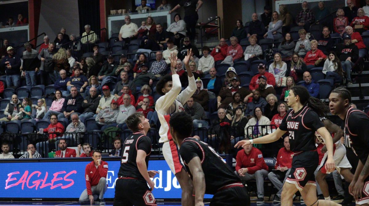 Devin Curtis, junior forward, shoots an open jump shot against Southern Illinois University Edwardsville's defense Saturday, Jan. 31, at Liberty Arena. (Photo by Anderson Schmidt)