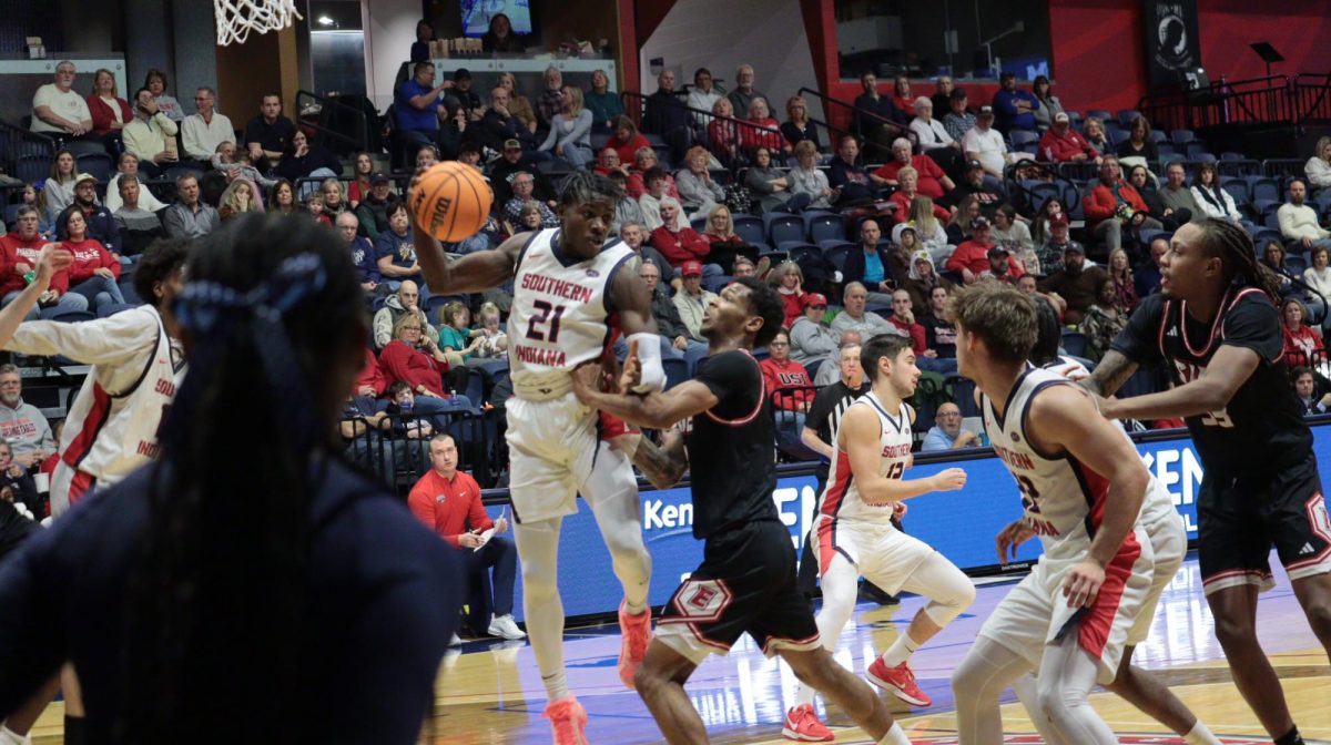 Devin Curtis, junior forward, shoots an open jump shot against Southern Illinois University Edwardsville's defense Saturday, Jan. 31, at Liberty Arena. (Photo by Anderson Schmidt)Cardell Bailey, senior guard, shoots a jump shot while Steven Clay, senior guard/forward, sets a screen for him at the game against Southern Illinois University Edwardsville Saturday, Jan. 31, at Liberty Arena. (Photo by Anderson Schmidt)Sheridan Sharp, junior guard, dribbles the ball around a screen set by Cardell Bailey, senior guard, during the game against Southern Illinois University Edwardsville Saturday, Jan. 31, at Liberty Arena. (Photo by Anderson Schmidt)Ismail Habib, senior guard, shoots a three-pointer over a Southern Illinois University Edwardsville defender Saturday, Jan. 31, at Liberty Arena. (Photo by Anderson Schmidt)Amaree Brown, junior guard/forward, prepares to defend a Southern Illinois University Edwardsville inbound pass Saturday, Jan. 31, at Liberty Arena. (Photo by Anderson Schmidt)Ismail Habib, senior guard, watches as Southern Indiana pressures Southern Illinois University Edwardsville in the backcourt Saturday, Jan. 31, at Liberty Arena. (Photo by Anderson Schmidt)Devin Curtis, junior forward, defends a Southern Illinois University Edwardsville player who is looking to pass Saturday, Jan. 31, at Liberty Arena. (Photo by Anderson Schmidt)Sheridan Sharp, junior guard, shoots an uncontested three-pointer against Southern Illinois University Edwardsville Saturday, Jan. 31, at Liberty Arena. (Photo by Anderson Schmidt)Devin Curtis, junior forward, shoots a three-pointer over a Southern Illinois University Edwardsville defender Saturday, Jan. 31, at Liberty Arena. (Photo by Anderson Schmidt)Ismail Habib, senior guard, pulls down a rebound after a Southern Illinois University Edwardsville player missed a free throw Saturday, Jan. 31, at Liberty Arena. (Photo by Anderson Schmidt)Cardell Bailey, senior guard, takes a shot over two SIUE defenders Saturday, Jan. 31 in Liberty Arena. (Photo by Anderson Schmidt)Cardell Bailey, senior guard, passes the ball to the left wing to open an offensive possession against Southern Illinois University Edwardsville Saturday, Jan. 31, at Liberty Arena. (Photo by Anderson Schmidt)