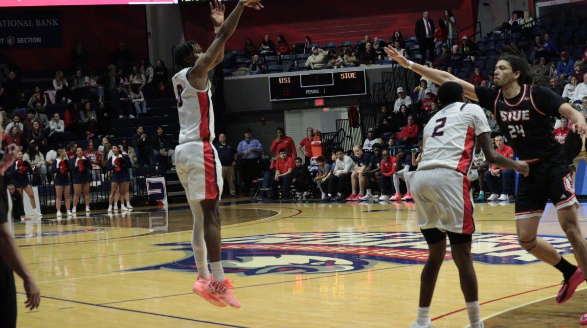 Cardell Bailey, senior guard, shoots a jump shot while Steven Clay, senior guard/forward, sets a screen for him at the game against Southern Illinois University Edwardsville Saturday, Jan. 31, at Liberty Arena. (Photo by Anderson Schmidt)