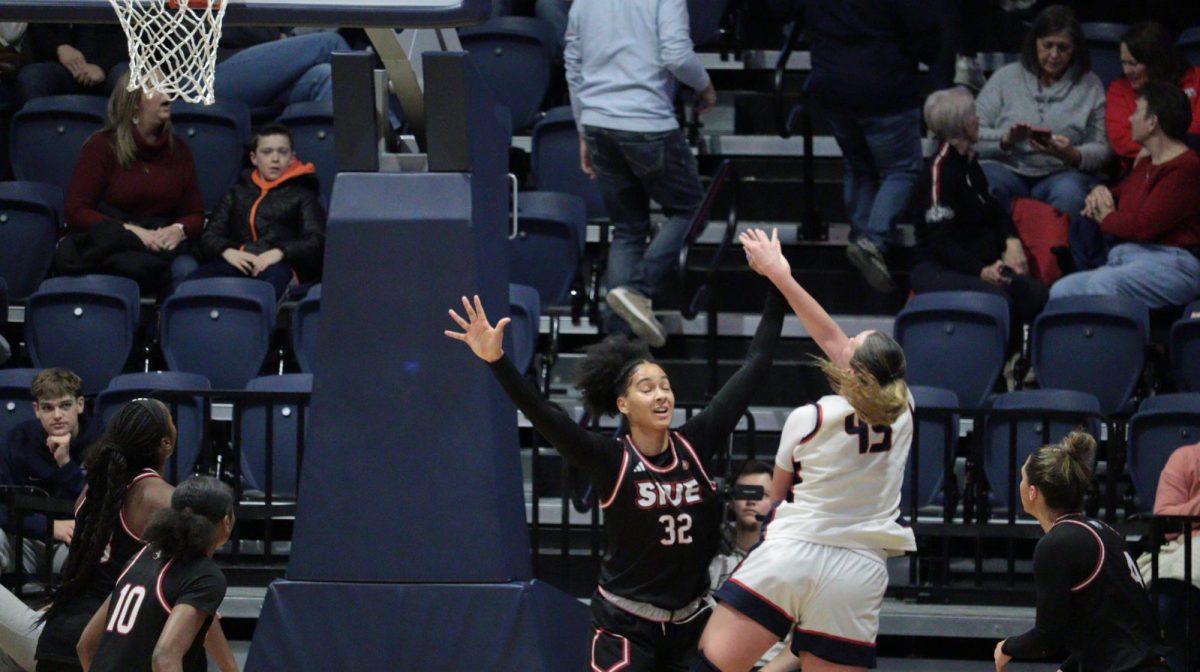 Chloe Gannon, junior forward/center, shoots a layup as she is fouled by a Southern Illinois University Edwardsville defender Saturday, Jan. 31, at Liberty Arena.Shannon Blacher, junior guard, shoots a three-pointer in front of a Southern Illinois University Edwardsville defender Saturday, Jan. 31, at Liberty Arena. (Photo by Anderson Schmidt) Ali Saunders, senior guard, shoots a jump shot from the free throw line against Southern Illinois University Edwardsville Saturday, Jan. 31, at Liberty Arena. (Photo by Anderson Schmidt) Sophia Loden, guard/forward, retreats on defense after draining a three-pointer against Southern Illinois University Edwardsville Saturday, Jan. 31, at Liberty Arena. (Photo by Anderson Schmidt)Shannon Blacher, junior guard, shoots a free throw during the game against Southern Illinois University Edwardsville Saturday, Jan. 31, at  Liberty Arena. (Photo by Anderson Schmidt)Lexi Sepulveda, sophomore guard, shoots a corner three-pointer against Southern Illinois University Edwardsville Saturday, Jan. 31, at Liberty Arena. (Photo by Anderson Schmidt)